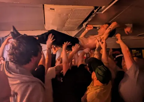 Band and audience got involved in the crowdsurf